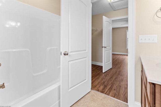 full bathroom featuring vanity and baseboards