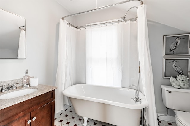 bathroom with a washtub, curtained shower, vanity, and toilet