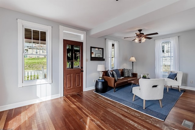 entryway featuring dark wood-style flooring, visible vents, ceiling fan, and baseboards