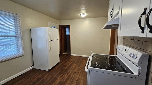 kitchen featuring white appliances, baseboards, under cabinet range hood, and dark wood-style floors