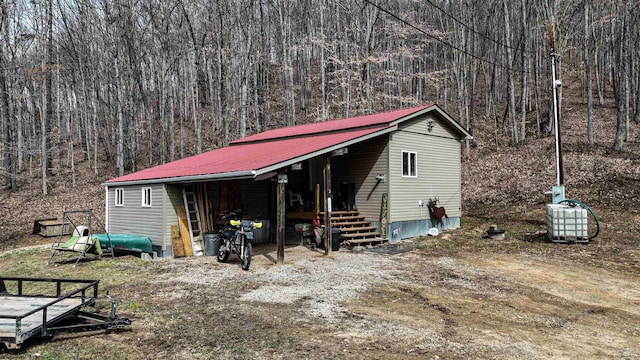 1819 Indian Creek Rd, Alma, WV 26320 - exterior space featuring metal roof and a view of trees