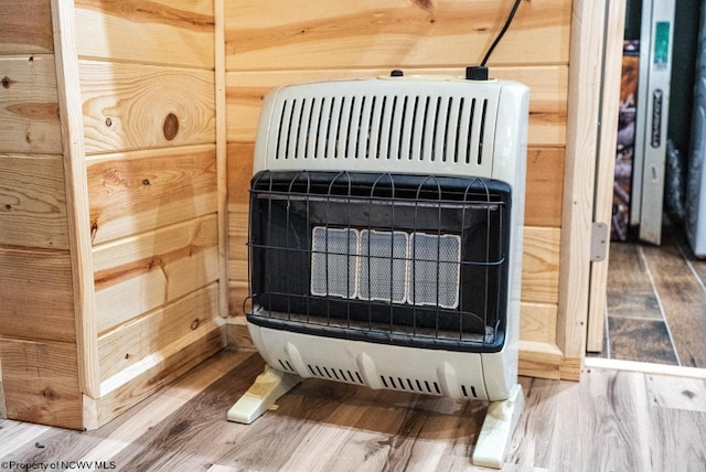 interior details with heating unit and wood finished floors