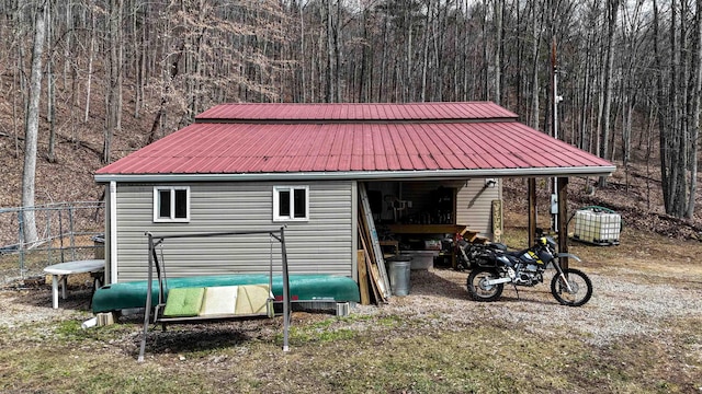 view of outdoor structure with a wooded view