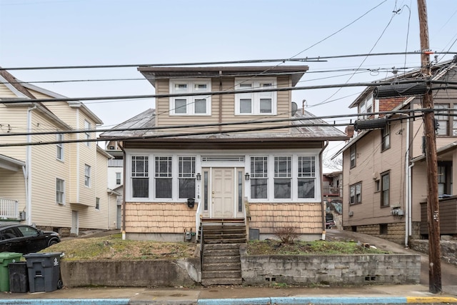 american foursquare style home featuring entry steps