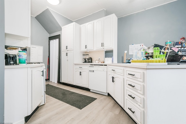 kitchen with light wood-style flooring, white cabinets, dishwasher, and light countertops