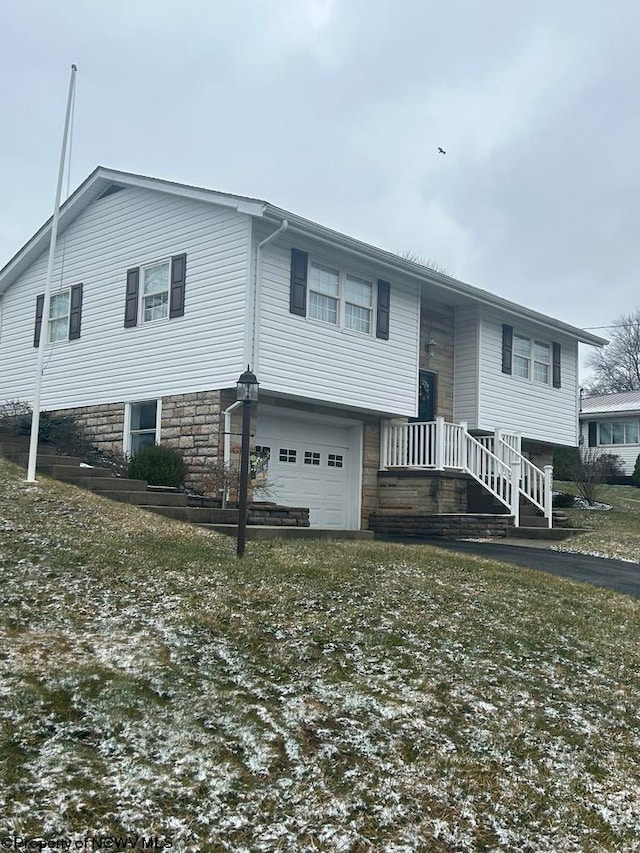 bi-level home featuring an attached garage