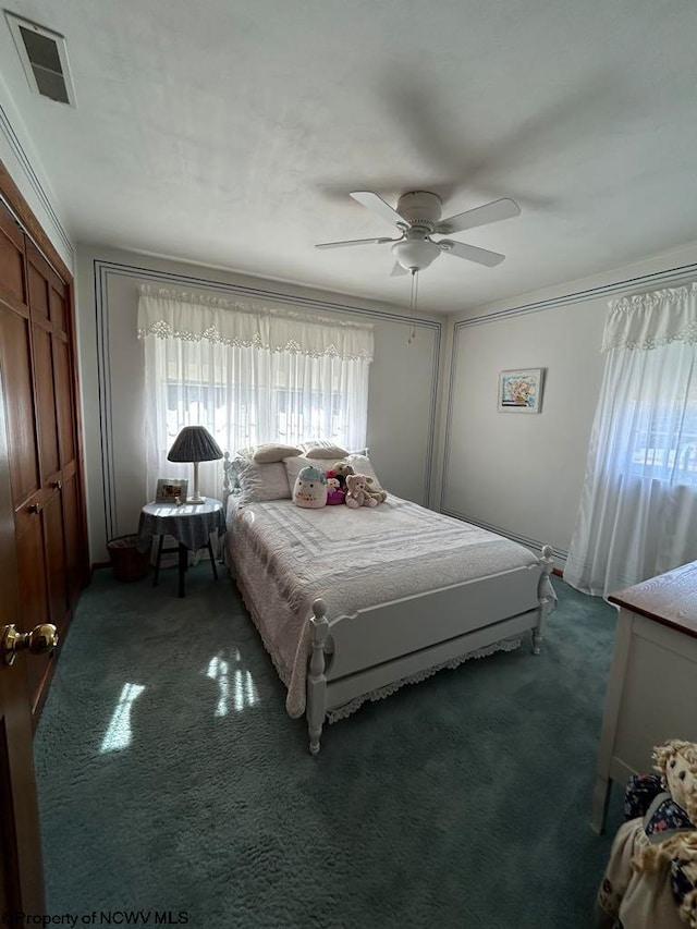 bedroom with a ceiling fan, carpet, and visible vents