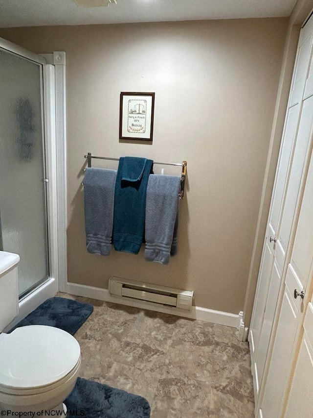 bathroom featuring a baseboard radiator, a shower stall, toilet, and baseboards