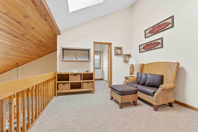 living area with high vaulted ceiling, a skylight, carpet flooring, wood ceiling, and baseboards