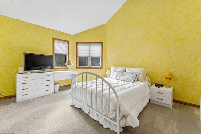 bedroom featuring wallpapered walls, baseboards, carpet, vaulted ceiling, and a textured ceiling