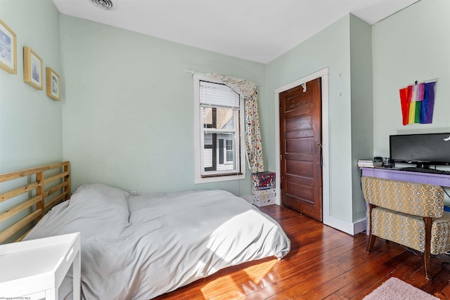 bedroom featuring hardwood / wood-style flooring