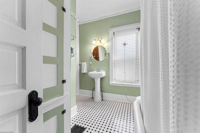 bathroom featuring baseboards