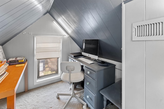 office area with carpet floors and vaulted ceiling