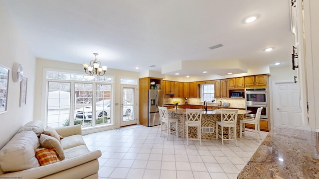 dining room featuring an inviting chandelier, light tile patterned flooring, visible vents, and recessed lighting