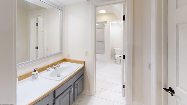 full bath featuring toilet, tile patterned flooring, and vanity