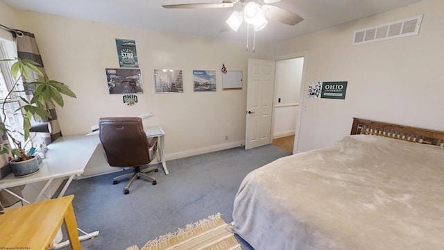 carpeted bedroom with visible vents, ceiling fan, and baseboards