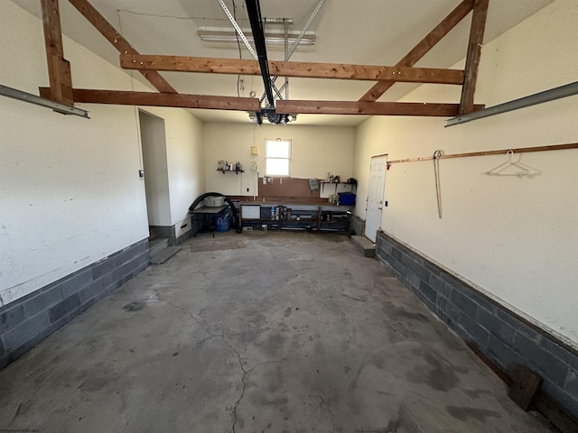 garage with concrete block wall