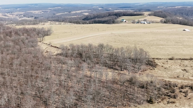 birds eye view of property with a rural view