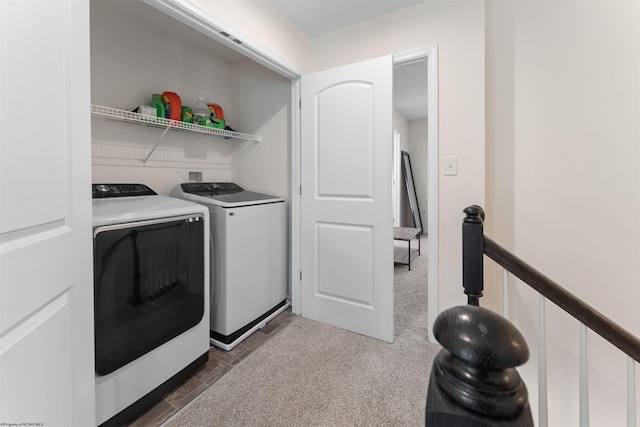 laundry room with laundry area, dark colored carpet, and washing machine and clothes dryer