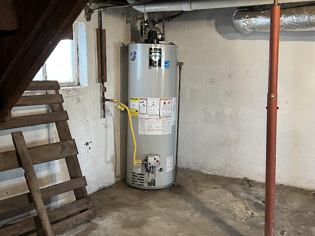 utility room with gas water heater