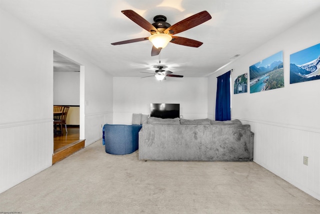 living area with a wainscoted wall