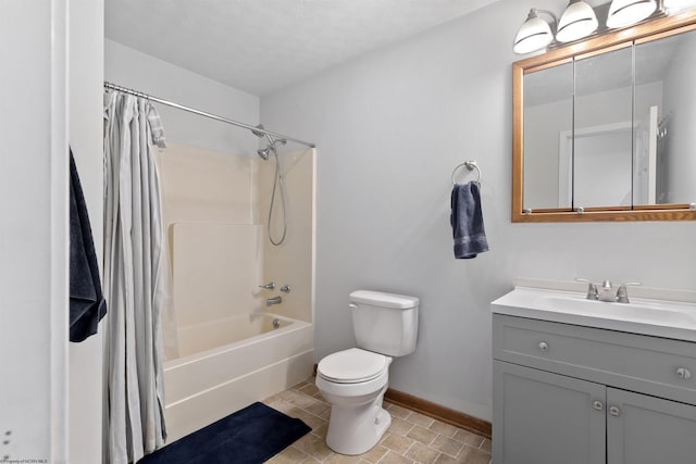 bathroom with shower / bath combo, baseboards, vanity, and toilet