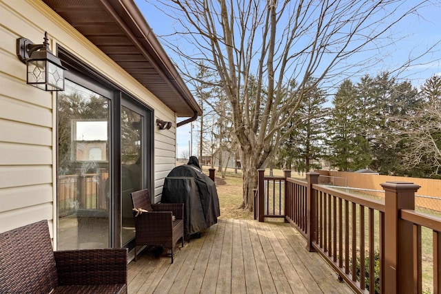 deck with fence and area for grilling