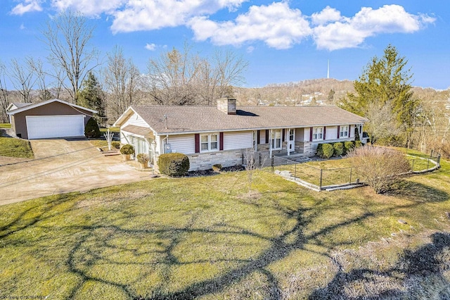 ranch-style home featuring an outbuilding, a detached garage, stone siding, a chimney, and a front yard