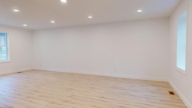 unfurnished room featuring baseboards, recessed lighting, visible vents, and light wood-style floors