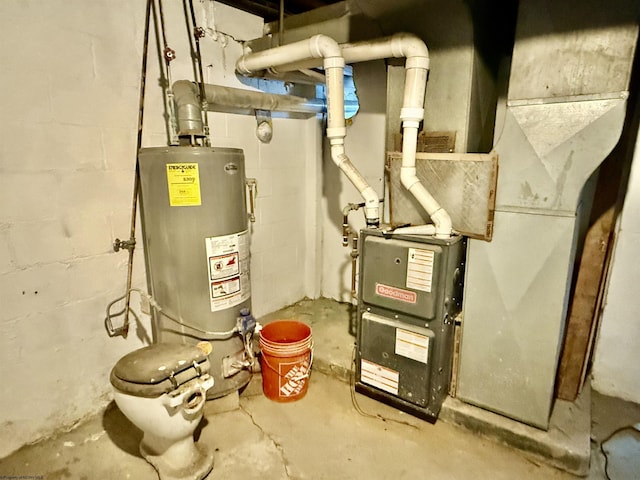 utility room featuring heating unit and water heater