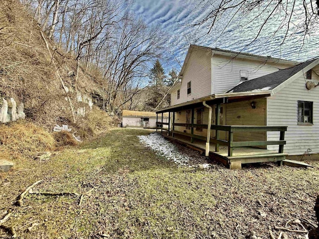 view of home's exterior with a wooden deck