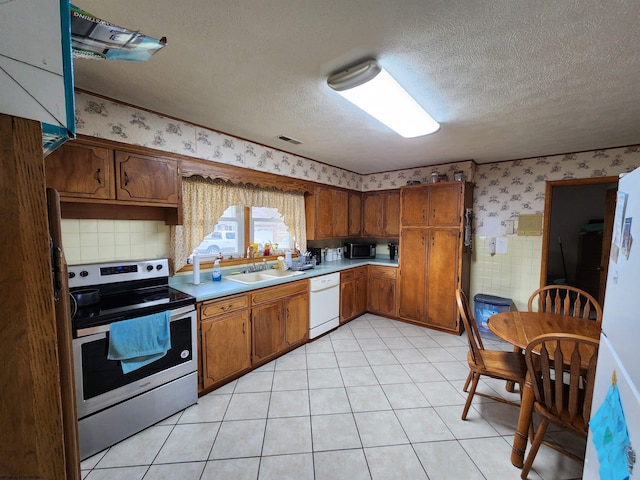 168 Locust Heights Dr, Clarksburg, WV 26301 - kitchen with a sink, a textured ceiling, wallpapered walls, stainless steel electric range oven, and dishwasher