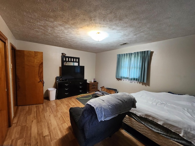 168 Locust Heights Dr, Clarksburg, WV 26301 - bedroom featuring light wood-style flooring, visible vents, and a textured ceiling