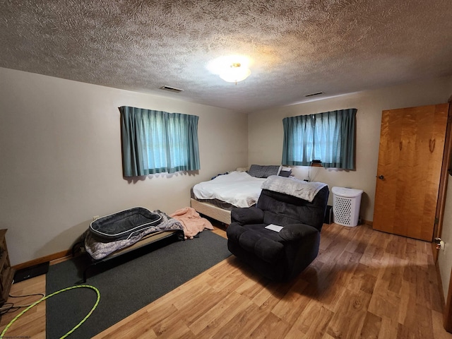 168 Locust Heights Dr, Clarksburg, WV 26301 - bedroom with visible vents, a textured ceiling, and wood finished floors
