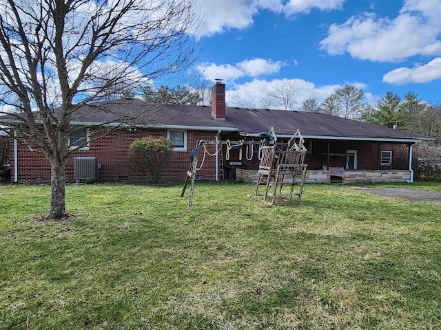 168 Locust Heights Dr, Clarksburg, WV 26301 - back of house with brick siding, a lawn, and a chimney