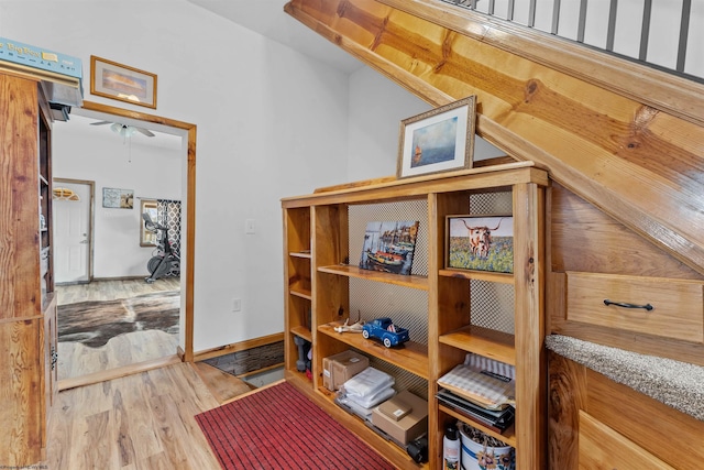 interior space with baseboards and wood finished floors