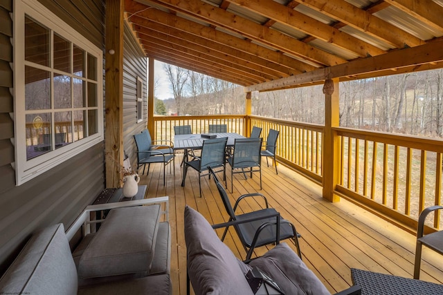 wooden terrace with outdoor dining area