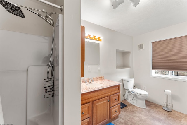 bathroom featuring visible vents, toilet, walk in shower, and vanity