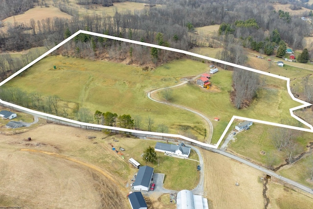 birds eye view of property featuring a rural view