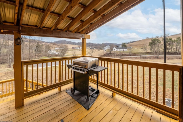 wooden deck featuring grilling area