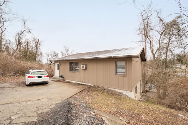 view of home's exterior featuring driveway