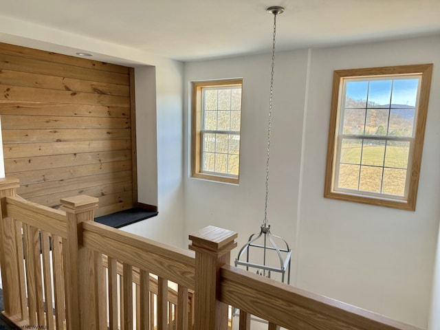 corridor featuring an upstairs landing