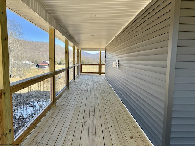 wooden deck featuring a mountain view