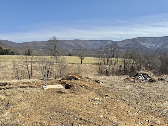 property view of mountains featuring a rural view