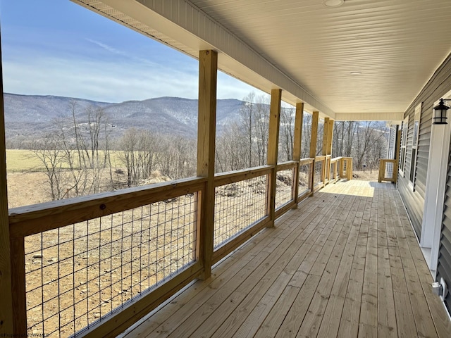 wooden deck featuring a mountain view