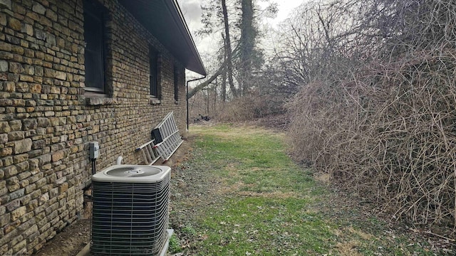 view of yard with central AC