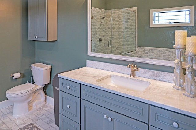 full bathroom featuring vanity, baseboards, a stall shower, toilet, and marble finish floor