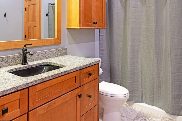 bathroom with toilet and vanity