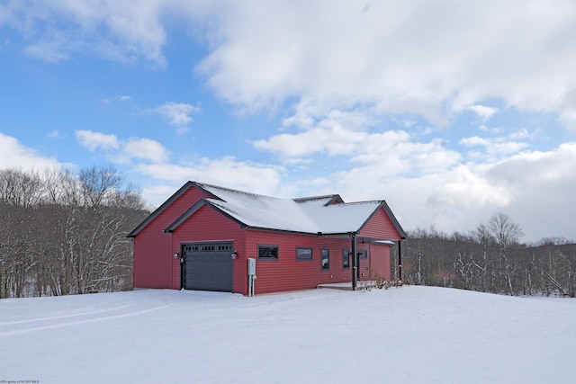 exterior space with a detached garage