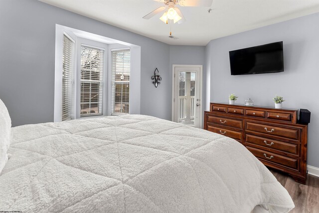 bedroom featuring wood finished floors and ceiling fan